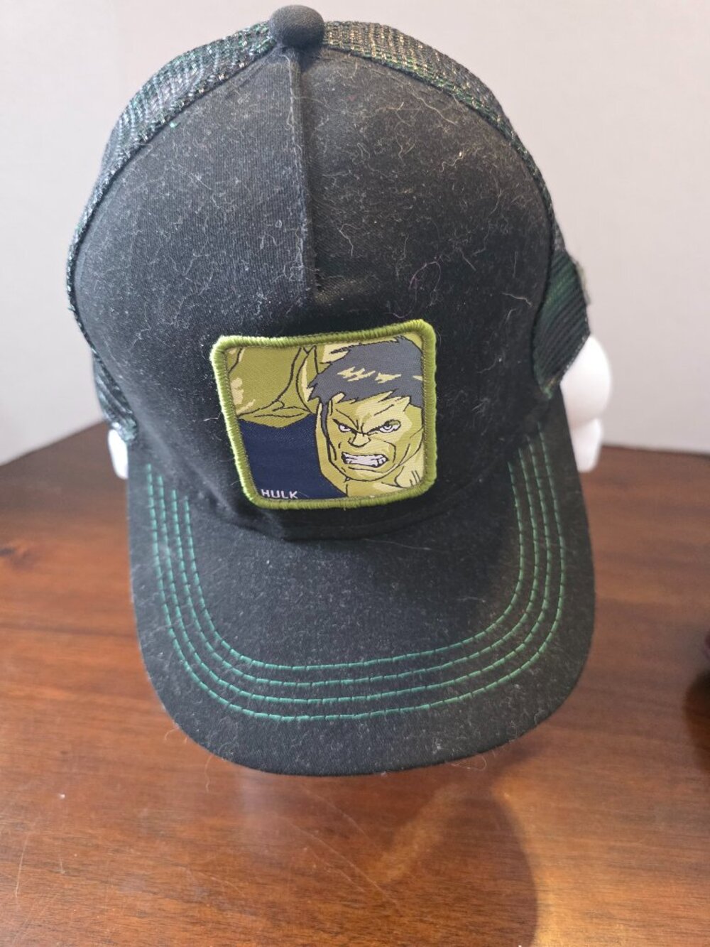 Marvel Comics snapback cap features a black mesh back